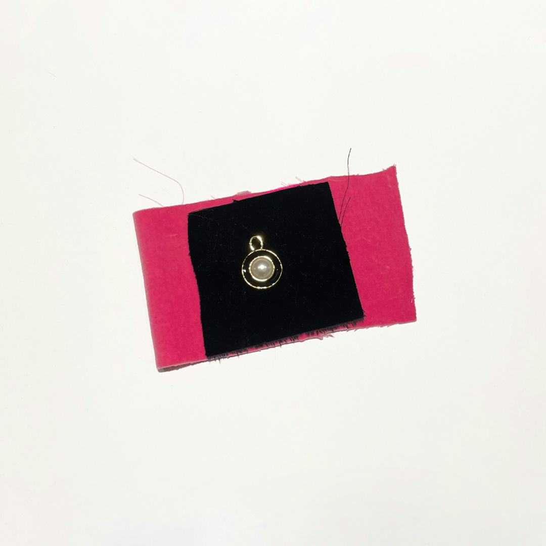 black pink fabric gold black zip detail